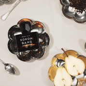 ROOM 1015 KOKOA BANG perfume gourmand de cacao creado por Jérôme Di Marino con notas de champán rosado, magnolia, vainilla y haba tonka
