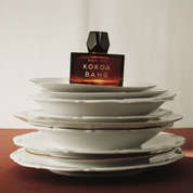 ROOM 1015 KOKOA BANG perfume gourmand de cacao creado por Jérôme Di Marino con notas de champán rosado, magnolia, vainilla y haba tonka